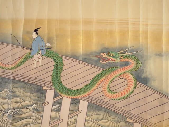 大蛇を恐れずに橋を通る秀郷（『俵藤太秀郷繪巻』より。出典：国立国会図書館デジタルコレクション）